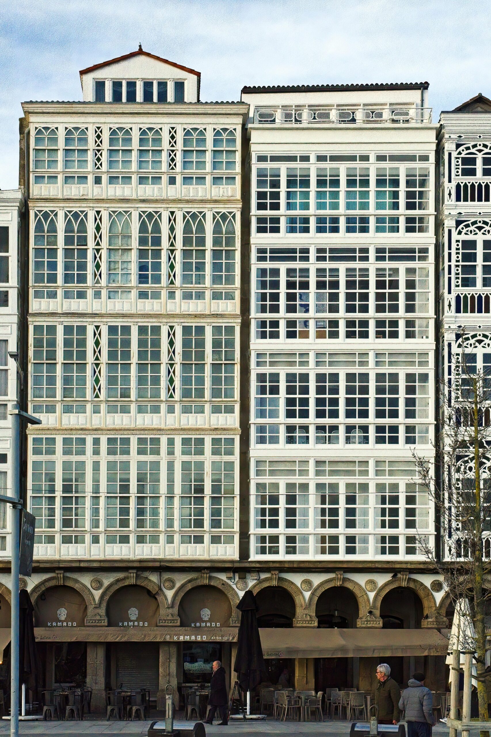 Vertical shot of ornate building facades in A Coruña, showcasing urban architecture.